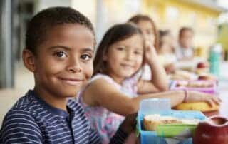 Kids Sitting at Lunch Table